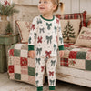Smiling child in 2-Piece Set Country Christmas Bows pajamas