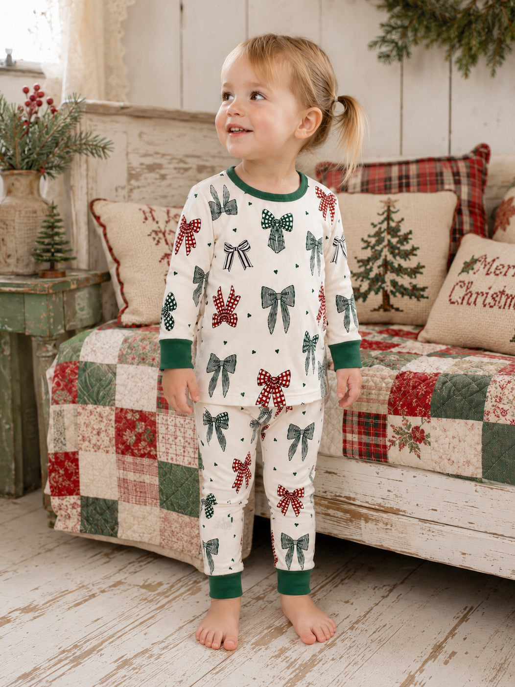 Smiling child in 2-Piece Set Country Christmas Bows pajamas