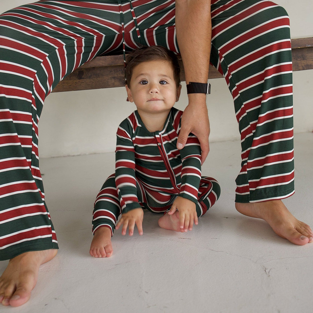 Matching Holiday Stripe pajamas for dad and baby