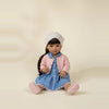 Nina doll sitting