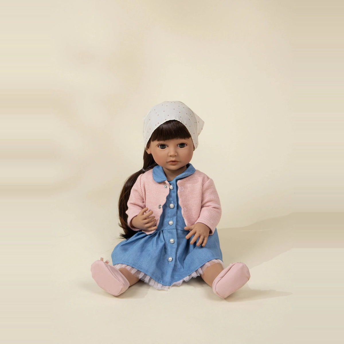 Nina doll sitting