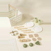 Wooden picnic playset pieces laid out