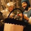 Kids trick-or-treating with the Pumpkin Stripe Treat Basket