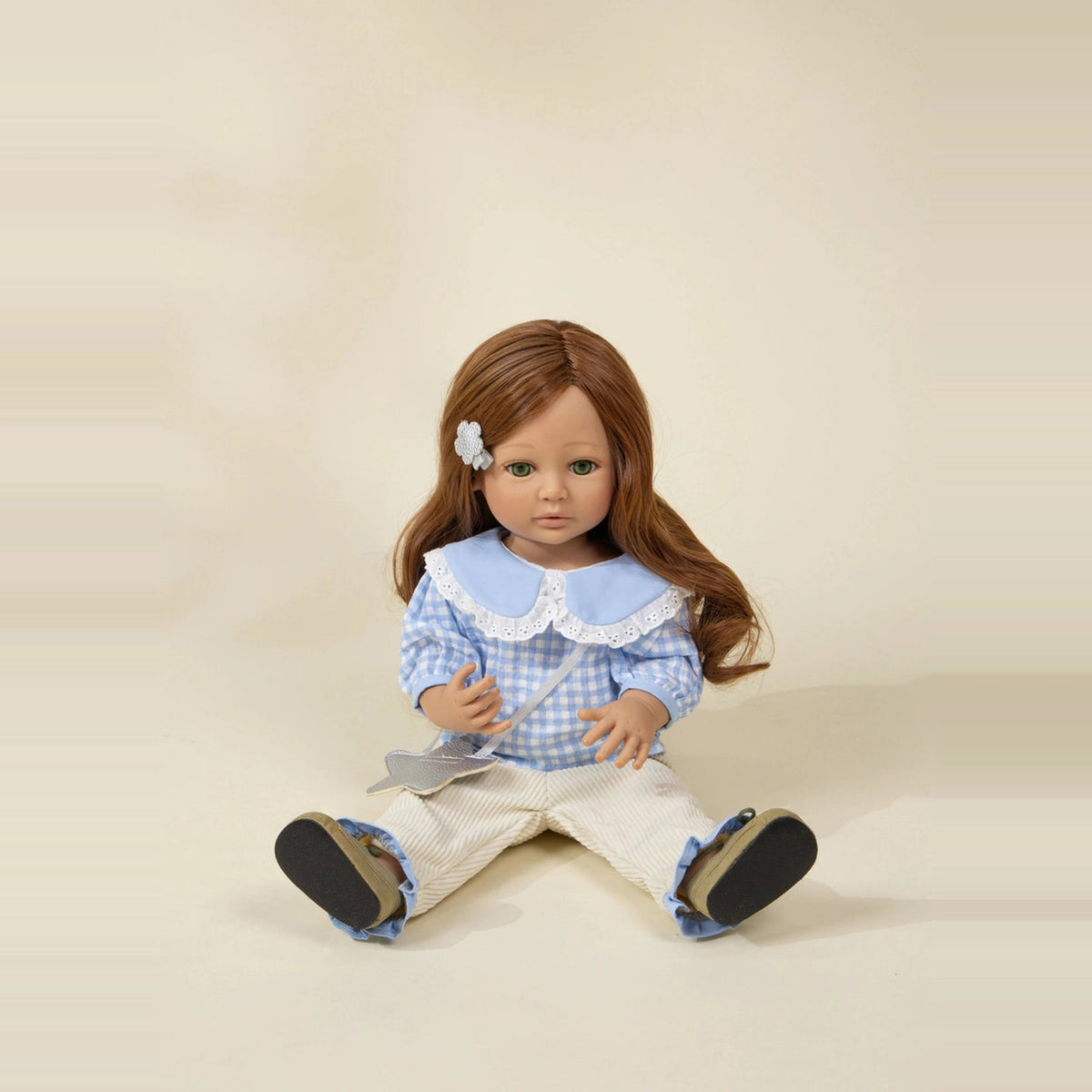 Rose doll sitting