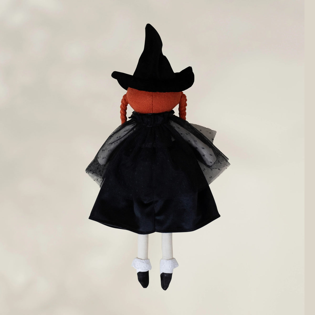 Witch plush toy back view