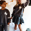 Which Witch pullover and skirt on two kids