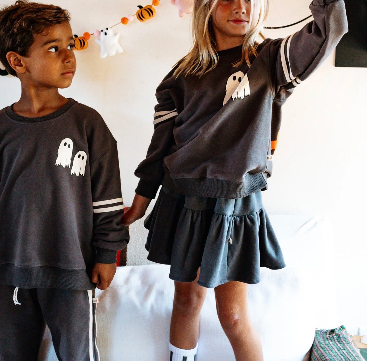 Which Witch pullover and skirt on two kids